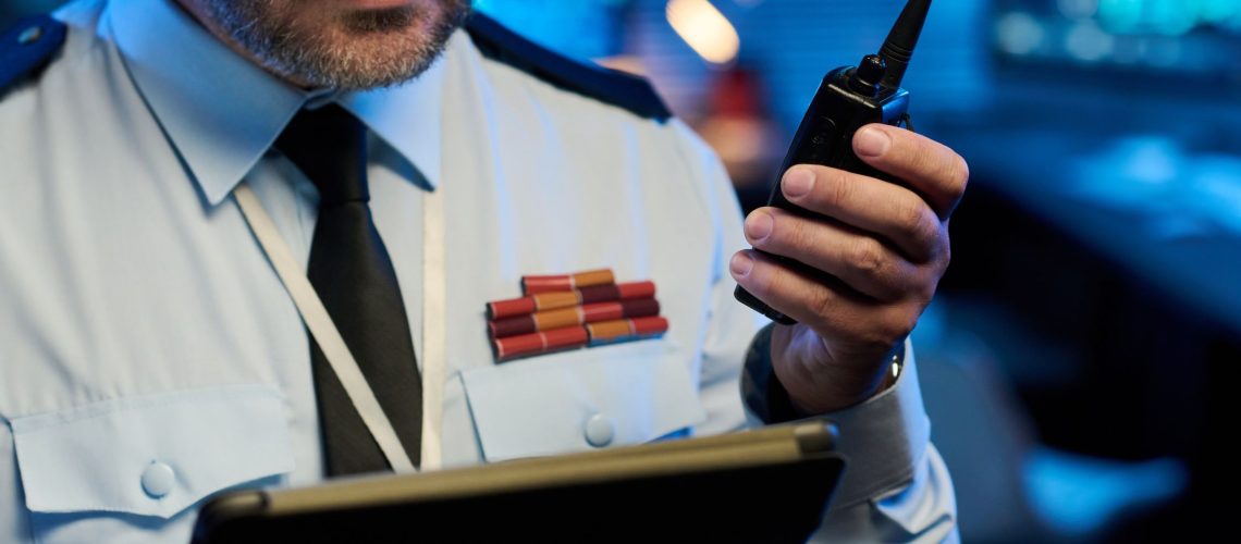 Officer with Tablet and Walkie-Talkie